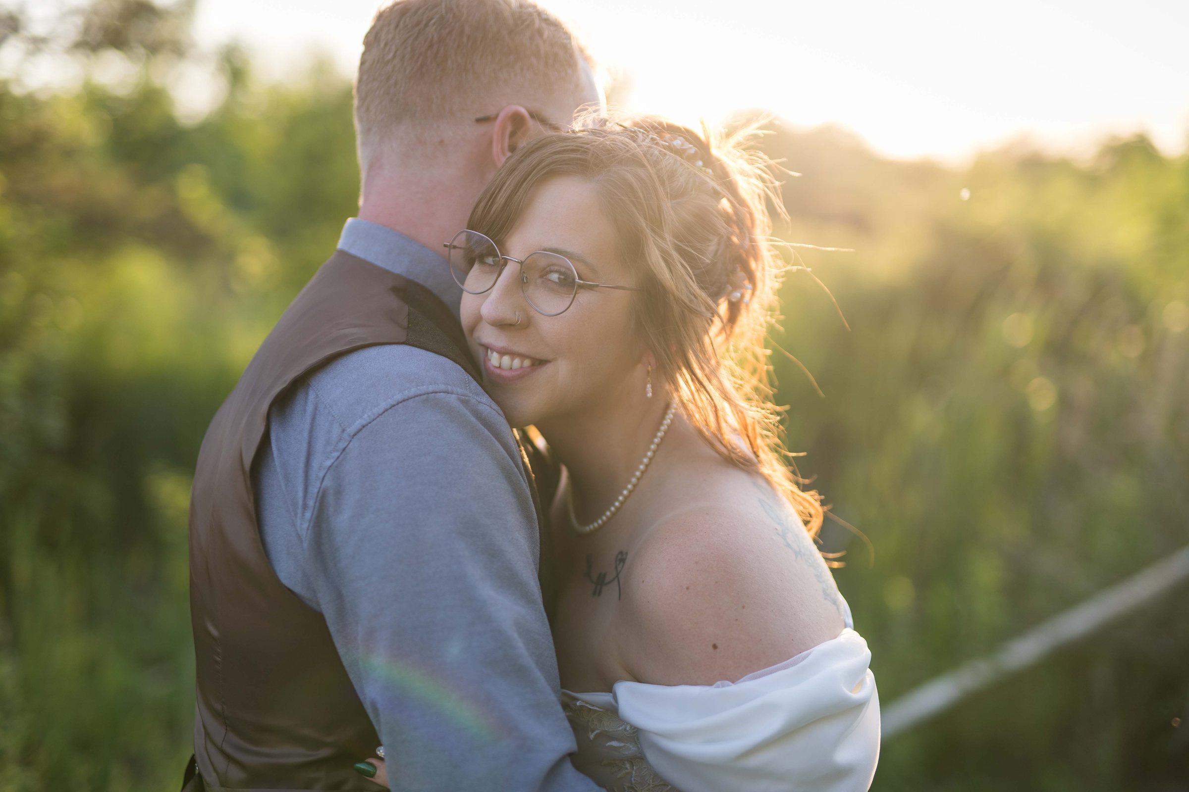 Hillary and Jake embracing at golden hour